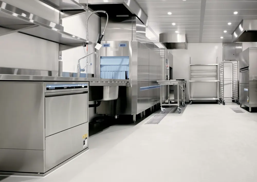 Stainless steel commercial kitchen with a dishwasher