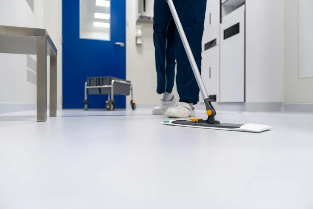 Flat mopping a bright corridor floor