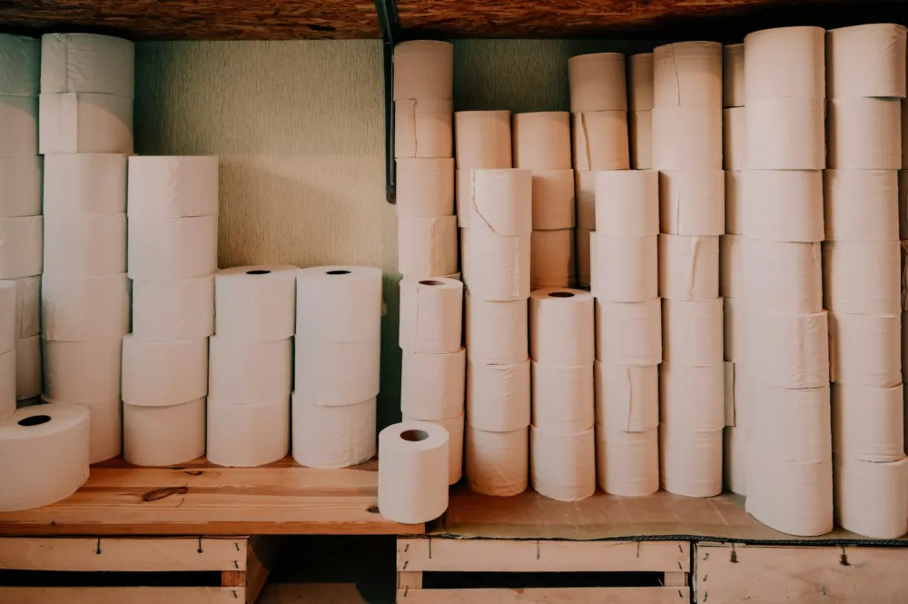 Wall of paper rolls in a stockroom
