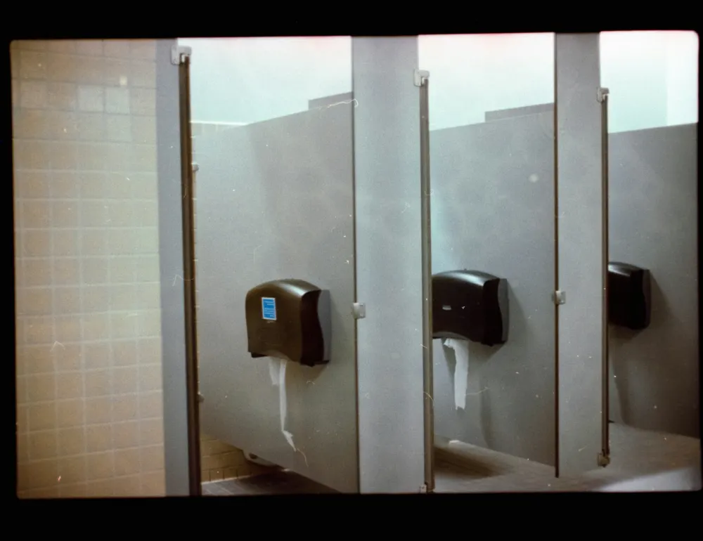 Toilet cubicles with paper dispensers