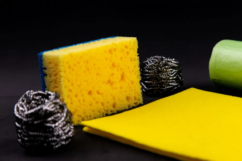 Sponge, steel scourers and a yellow cloth